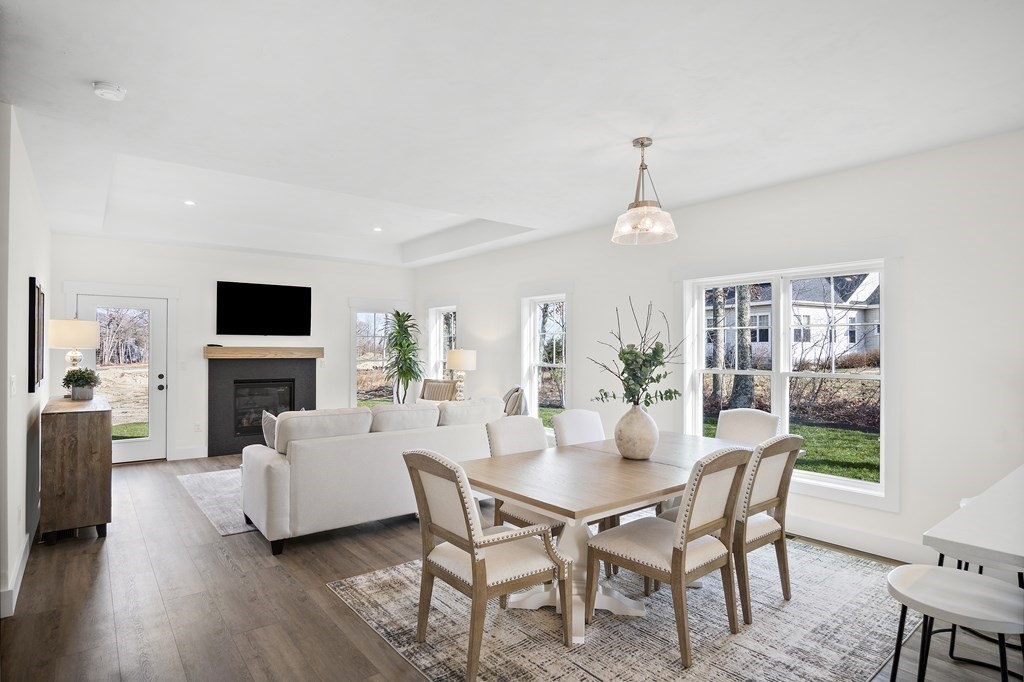 25 Salisbury Hill Boulevard, Unit 64 Worcester, MA 01609 - Photo 8 of 41 a view of a dining room with furniture window and wooden floor