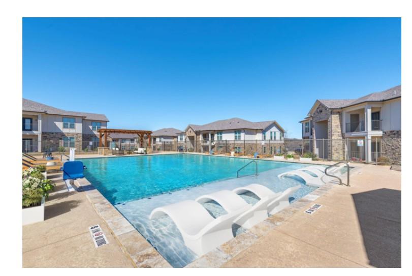 a view of a patio with couches and table potted plants