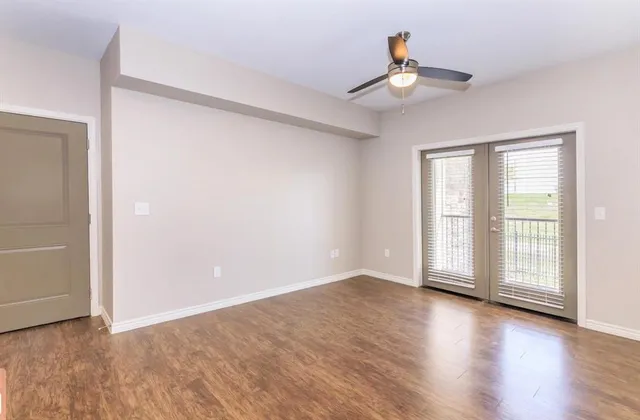 a view of kitchen with refrigerator microwave and stove