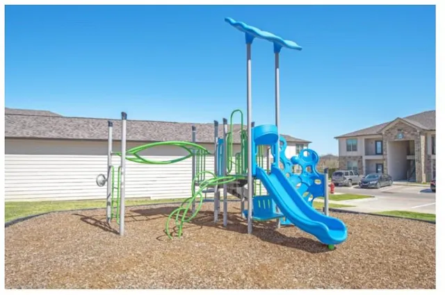 a view of a park with a slide