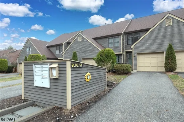 a front view of a house with garage