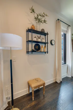 a view of a room with wooden floor and closet