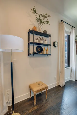 a view of a room with wooden floor and closet