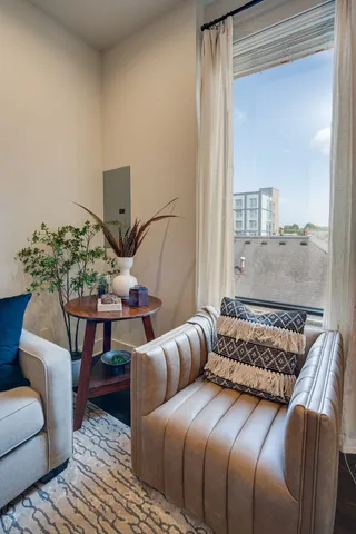 a bedroom with furniture and wooden floor