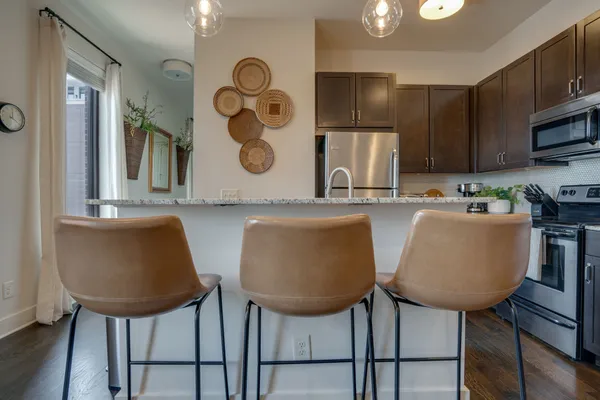 a view of kitchen with cabinets and stainless steel appliances