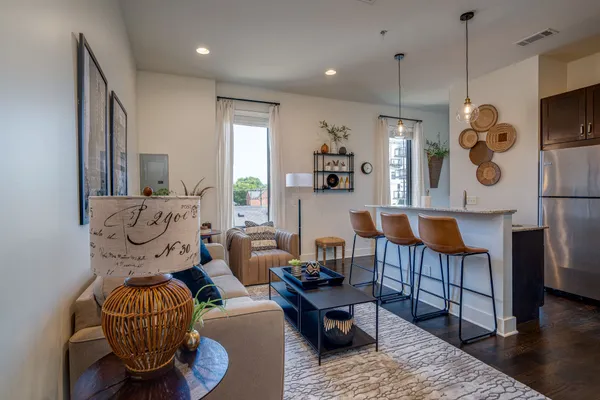 a living room with furniture and a table