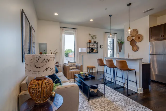 a living room with furniture and a table