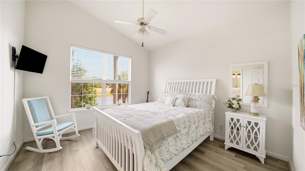 705 Augusta Circle, Unit 705 St. Augustine, FL 32086 - Photo 19 of 53 a bedroom with a bed and a table