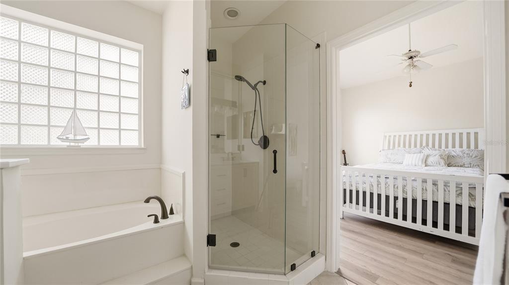 705 Augusta Circle, Unit 705 St. Augustine, FL 32086 - Photo 23 of 53 a bathroom with a bathtub and shower