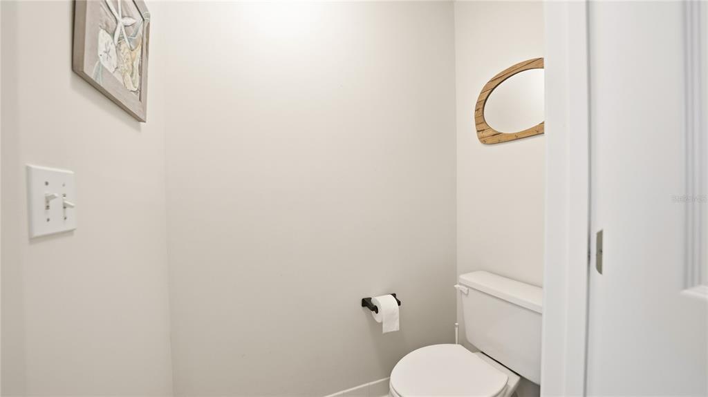 705 Augusta Circle, Unit 705 St. Augustine, FL 32086 - Photo 24 of 53 a white toilet sitting next to a shower