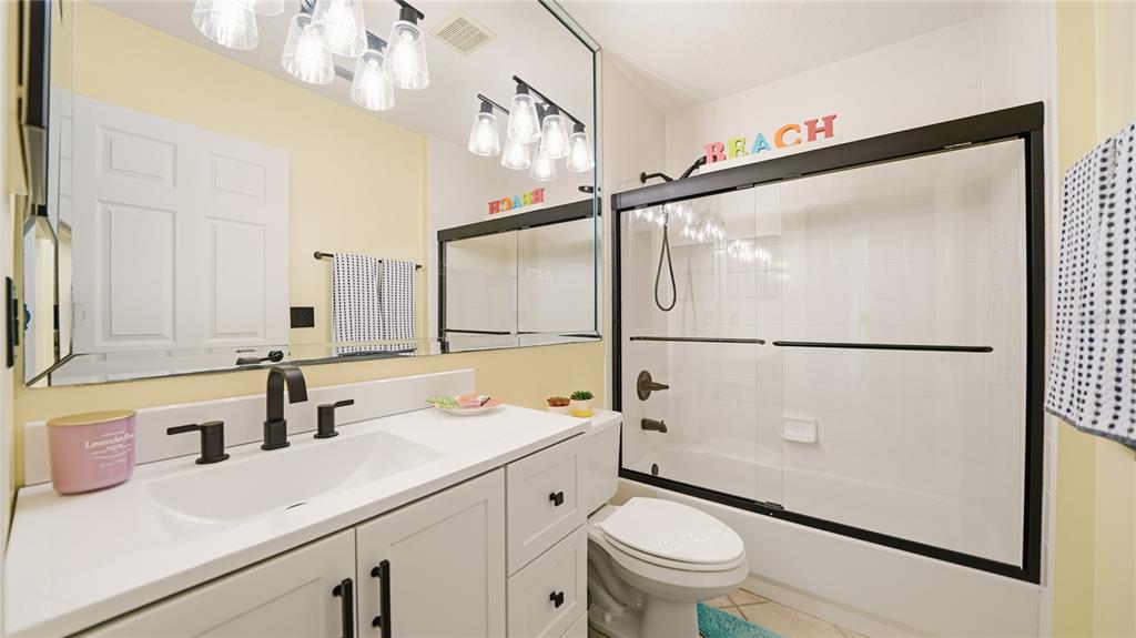 705 Augusta Circle, Unit 705 St. Augustine, FL 32086 - Photo 30 of 53 a bathroom with a sink a toilet a mirror and shower