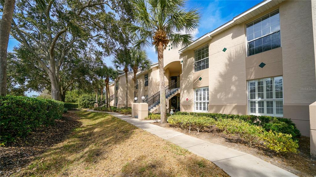705 Augusta Circle, Unit 705 St. Augustine, FL 32086 - Photo 37 of 53 a front view of a house with a yard