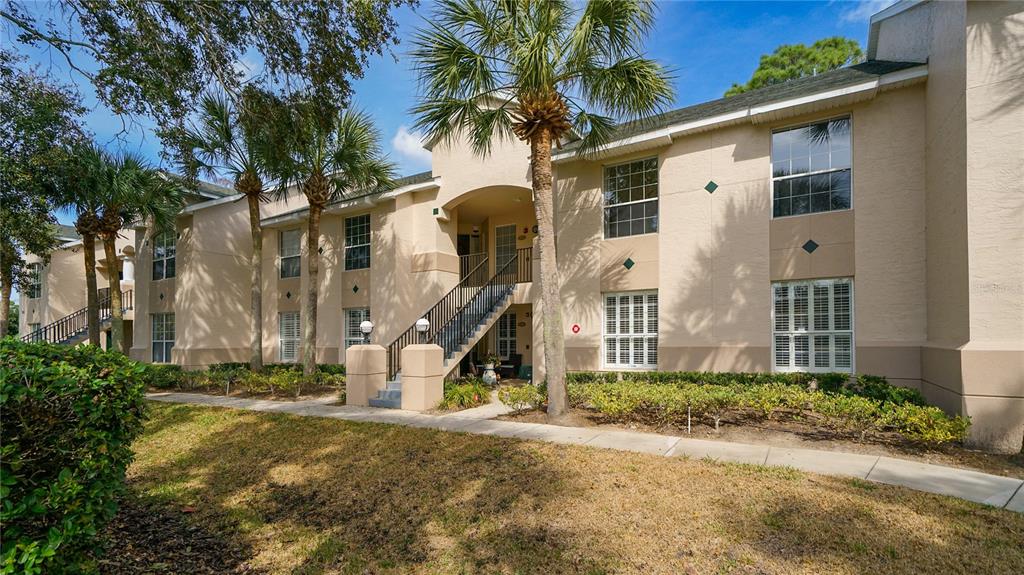 705 Augusta Circle, Unit 705 St. Augustine, FL 32086 - Photo 40 of 53 a front view of a house with a yard