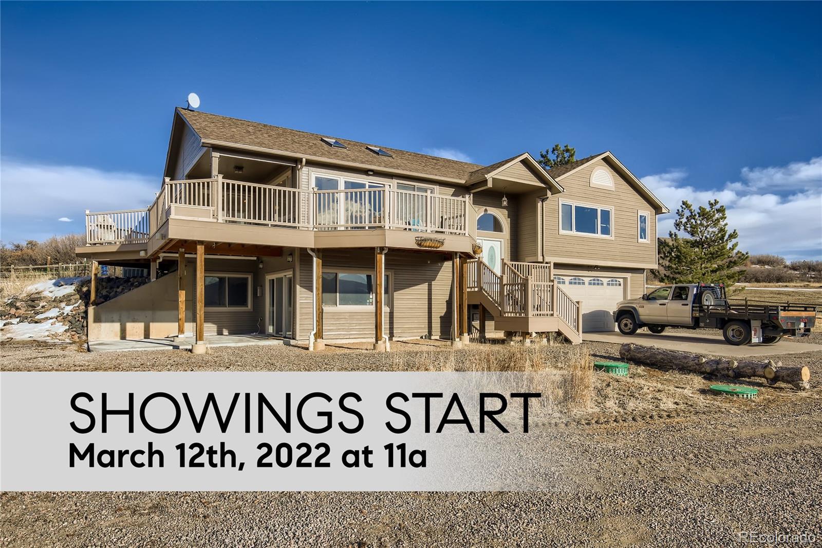 3961 Bear Canyon Circle Sedalia, CO 80135 - Photo 1 of 40 a view of a white house with large windows