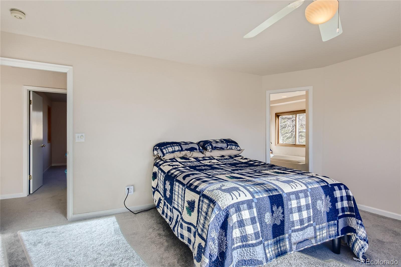 3961 Bear Canyon Circle Sedalia, CO 80135 - Photo 15 of 40 a bedroom with a bed and a window
