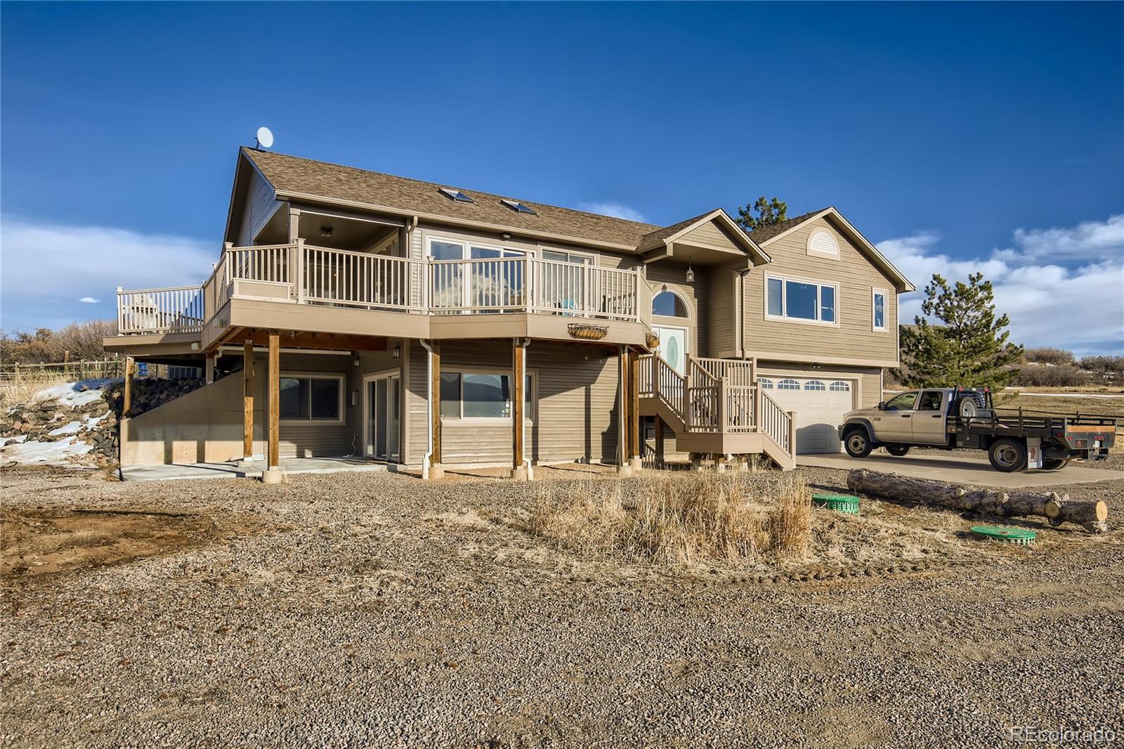 3961 Bear Canyon Circle Sedalia, CO 80135 - Photo 2 of 40 a front view of a house with a yard
