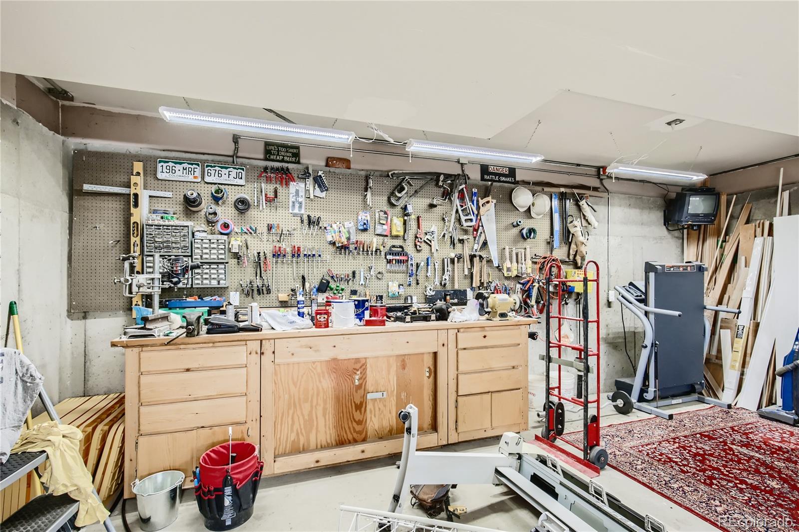 3961 Bear Canyon Circle Sedalia, CO 80135 - Photo 26 of 40 a view of walk in closet with clothes and shoes