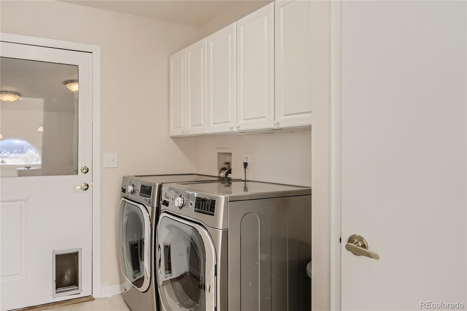 3961 Bear Canyon Circle Sedalia, CO 80135 - Photo 27 of 40 a utility room with dryer and washer
