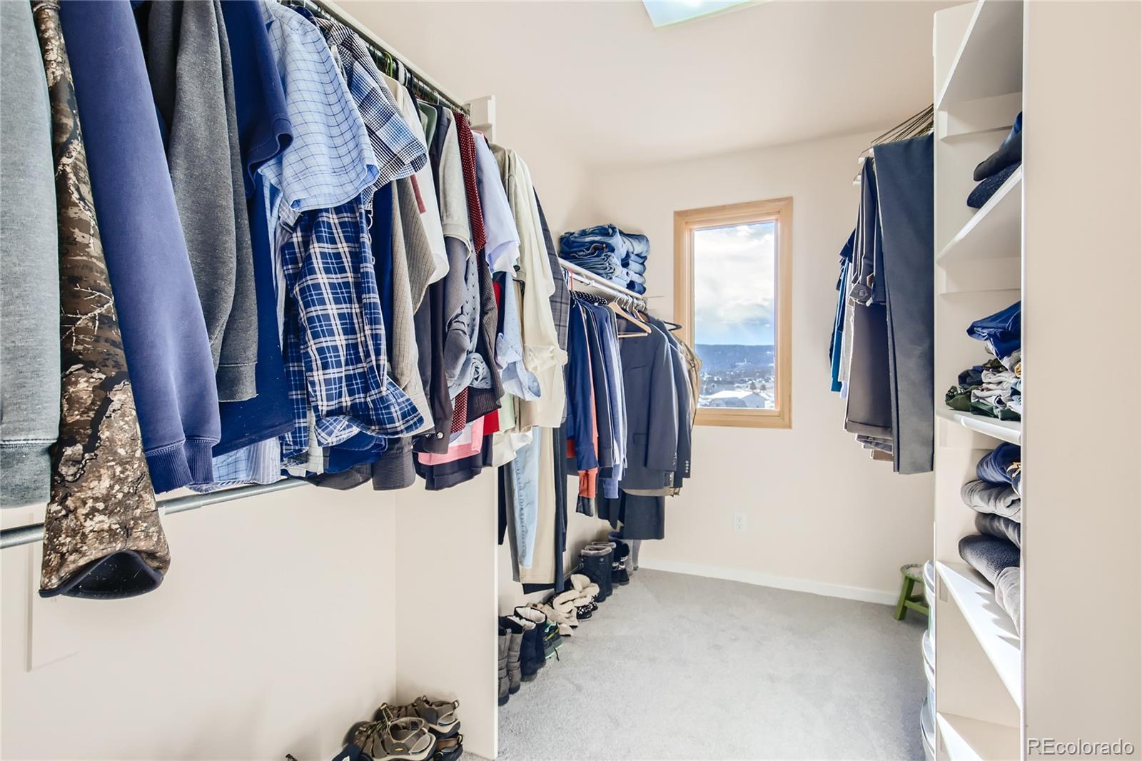 3961 Bear Canyon Circle Sedalia, CO 80135 - Photo 28 of 40 a view of walk in closet with clothes