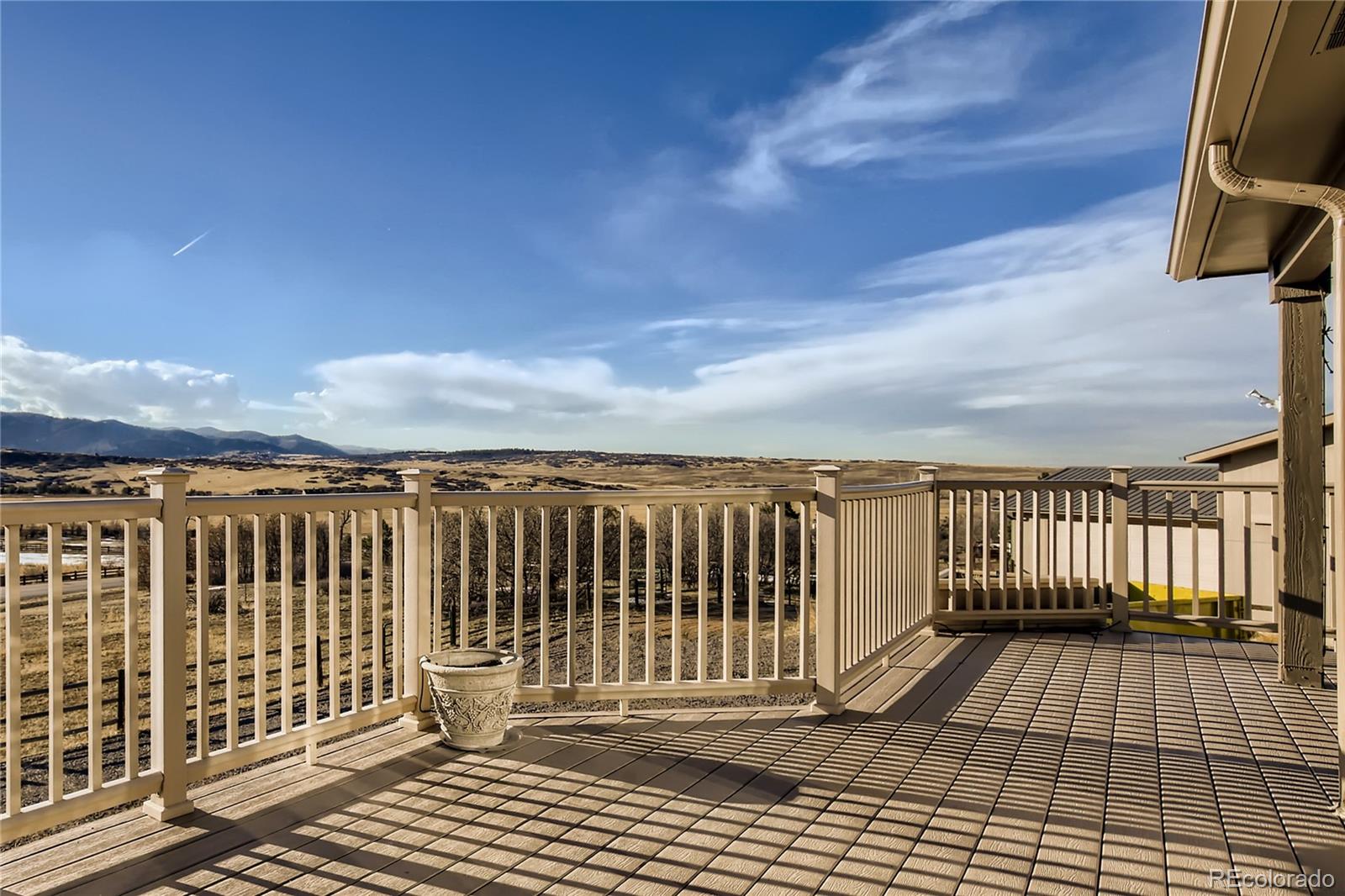 3961 Bear Canyon Circle Sedalia, CO 80135 - Photo 31 of 40 a view of a balcony with wooden fence