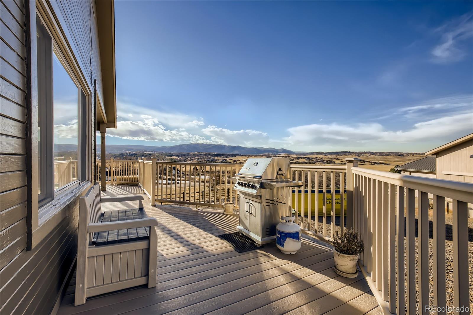 3961 Bear Canyon Circle Sedalia, CO 80135 - Photo 35 of 40 a view of a balcony with wooden floor