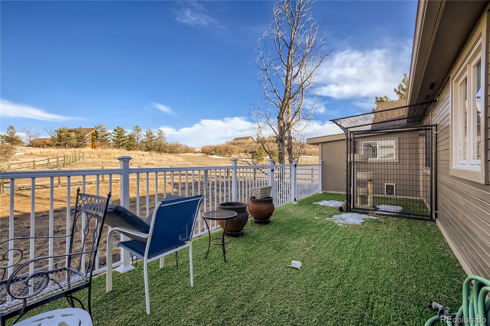 3961 Bear Canyon Circle Sedalia, CO 80135 - Photo 36 of 40 a view of a patio with chairs and a table