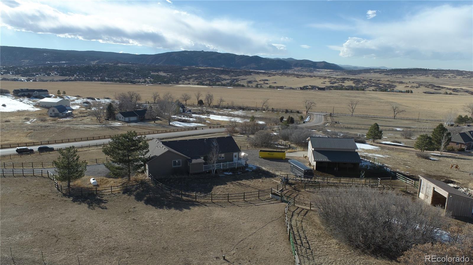 3961 Bear Canyon Circle Sedalia, CO 80135 - Photo 39 of 40 a terrace with outdoor seating and city view