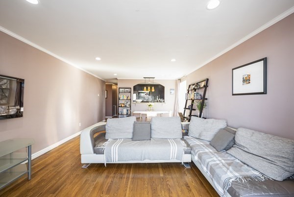 16 Addington Road, Unit 46 Brookline, MA 02445 - Photo 20 of 24 a living room with furniture and wooden floor