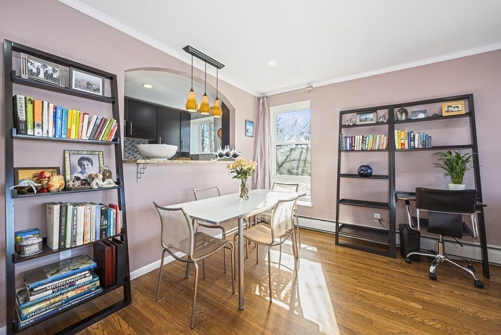 16 Addington Road, Unit 46 Brookline, MA 02445 - Photo 6 of 24 a view of a livingroom with furniture and a bookshelf