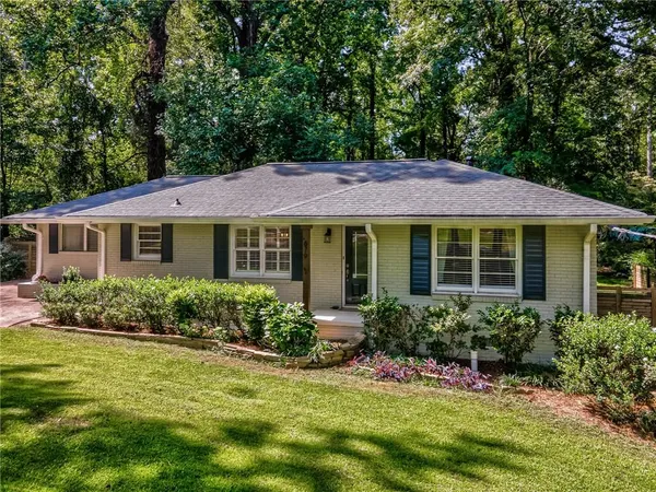 a front view of a house with a yard and porch