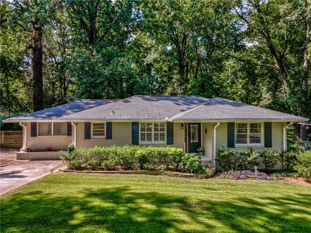 a view of a deck with a table and chairs