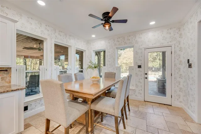 a dining room with furniture and window
