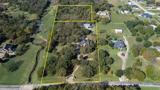 an aerial view of residential house with outdoor space