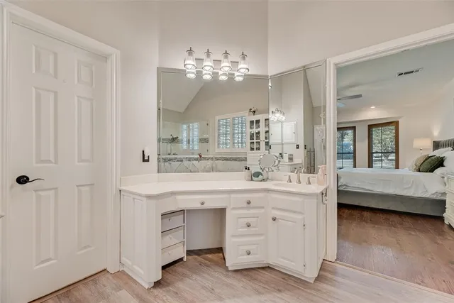 a spacious bathroom with a double vanity sink double and mirror