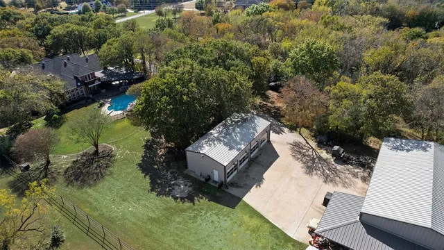 an aerial view of residential house with outdoor space