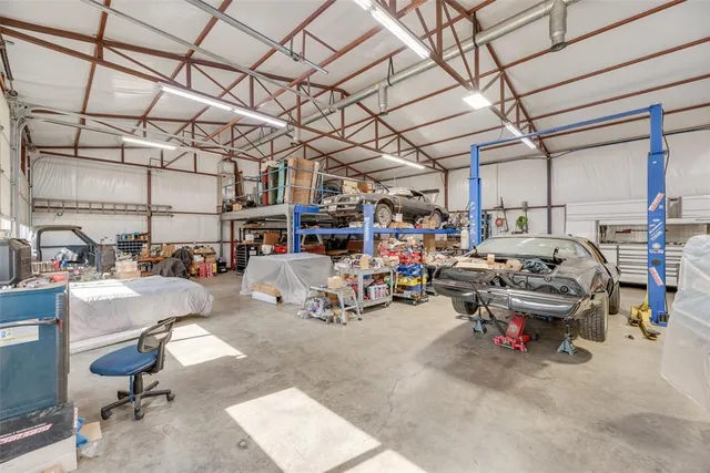 a view of parking garage with cars