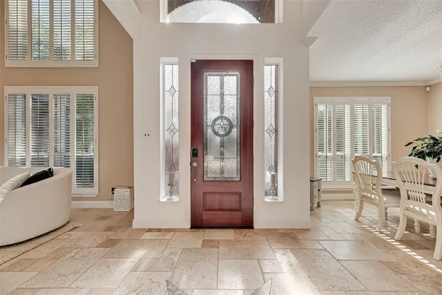 a view of a livingroom with furniture and windows