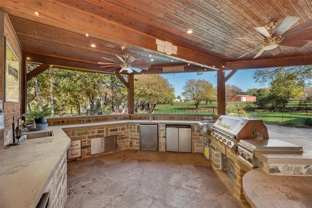 a view of a patio with couches chairs and a yard