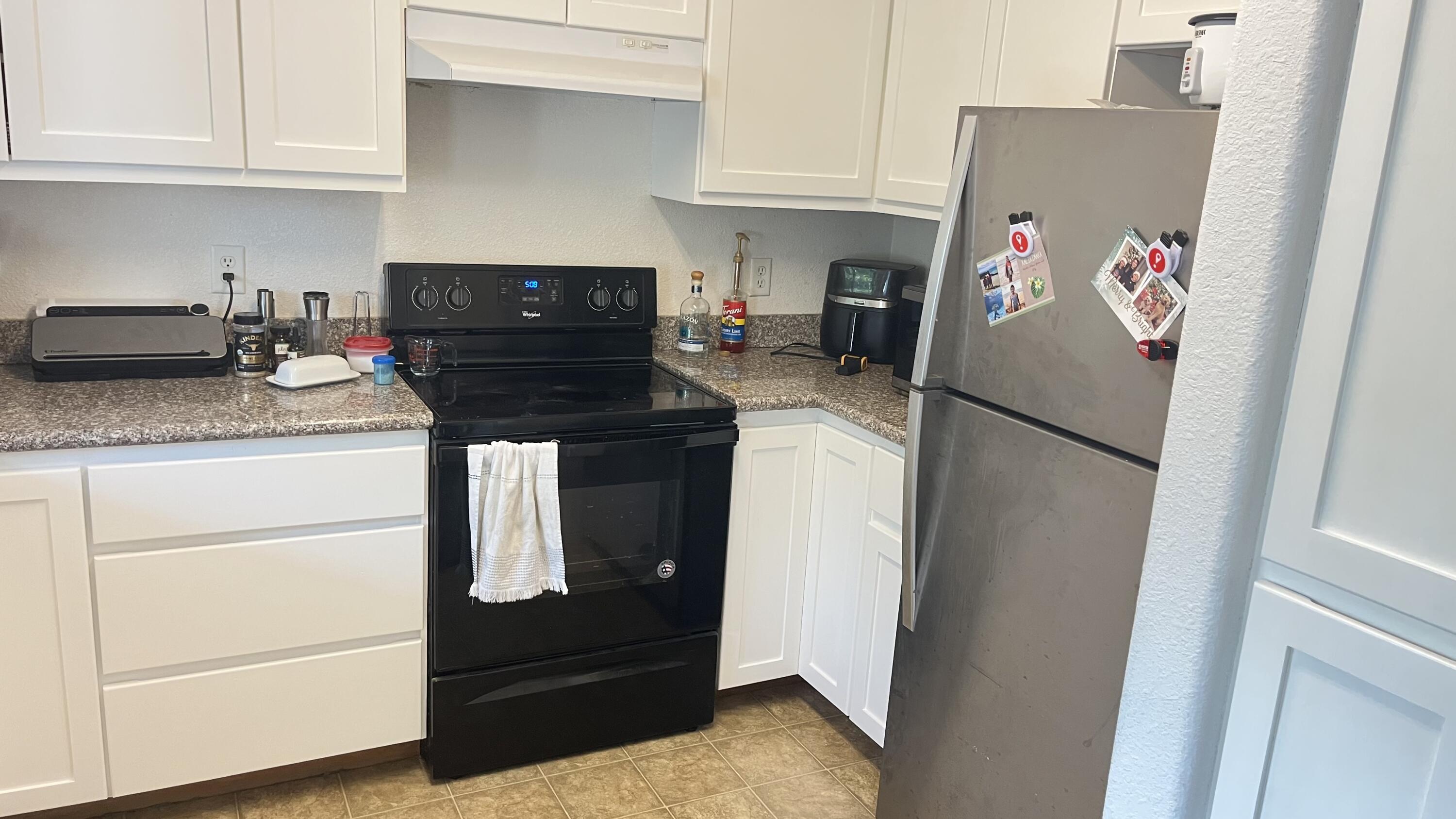 450 Midway Road, Unit 5 Medford, OR 97501 - Photo 18 of 46 a kitchen with stainless steel appliances granite countertop white refrigerator and cabinets
