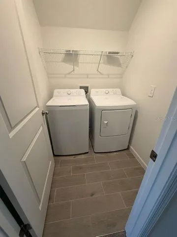 a utility room with dryer and washer