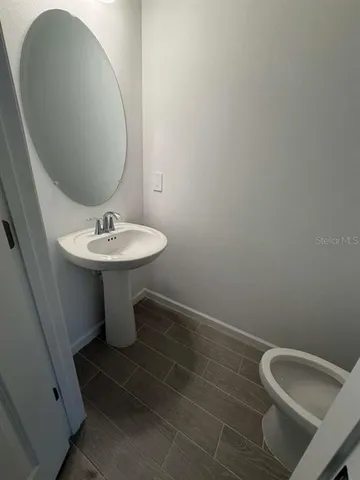 a bathroom with a sink and mirror