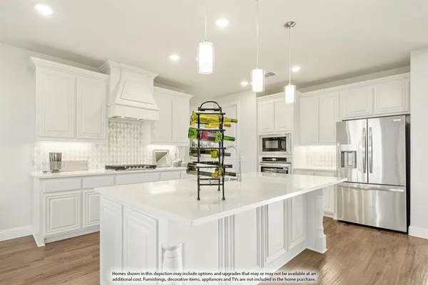 a kitchen with counter top space cabinets and stainless steel appliances