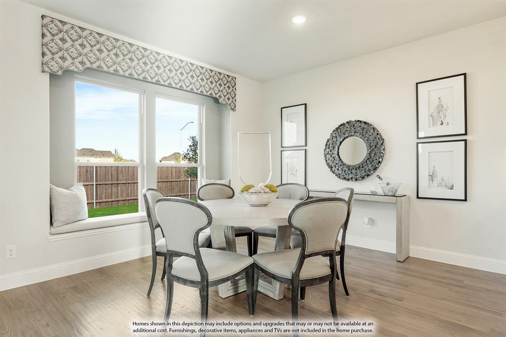 5230 Rutherford Drive Midlothian, TX 76065 - Photo 15 of 35 a view of a dining room with furniture window and wooden floor
