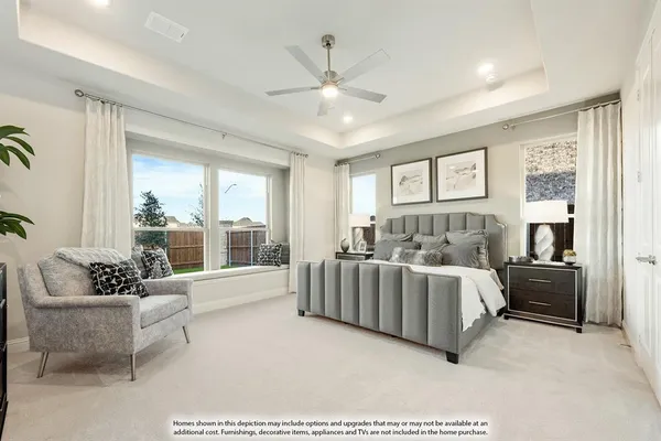 a spacious bedroom with a bed and a couch