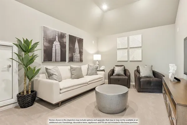 a living room with furniture and a potted plant