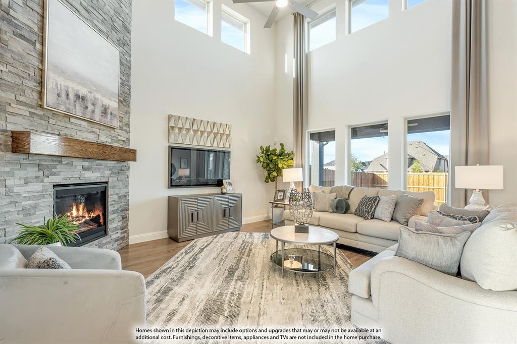 5230 Rutherford Drive Midlothian, TX 76065 - Photo 3 of 35 a living room with furniture a fireplace and a flat screen tv
