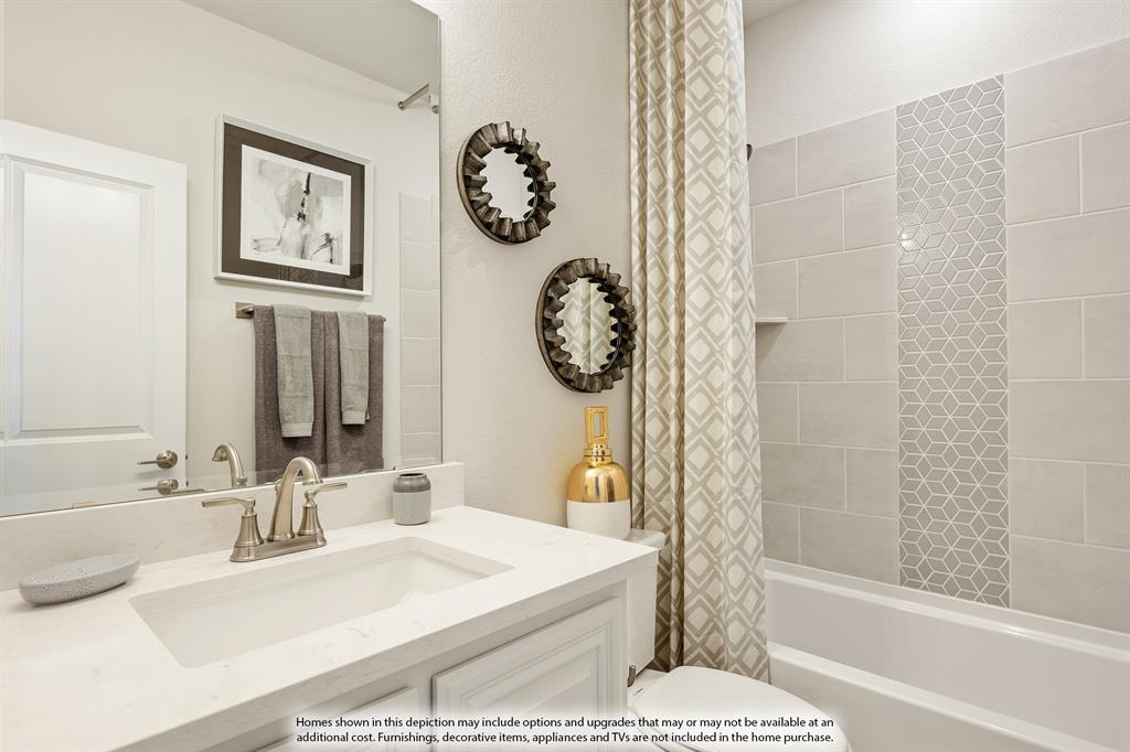 5230 Rutherford Drive Midlothian, TX 76065 - Photo 31 of 35 a bathroom with a bathtub a picture and a shower