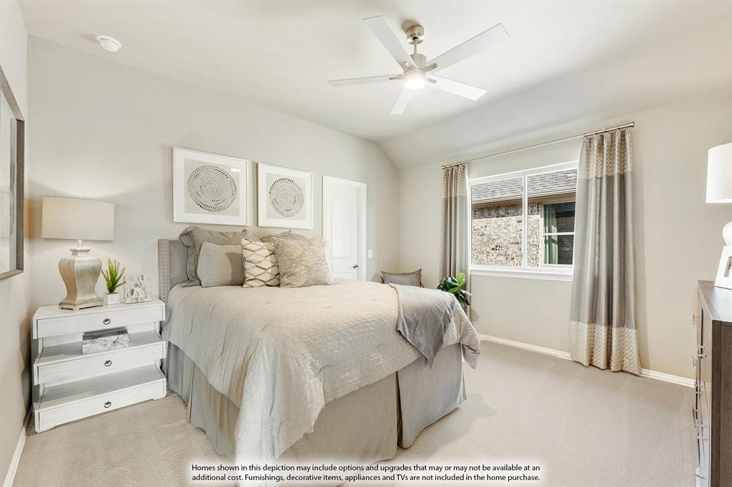 5230 Rutherford Drive Midlothian, TX 76065 - Photo 32 of 35 a bedroom with a large bed and a chandelier