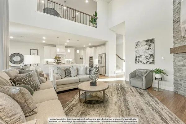 a living room with furniture and view of kitchen