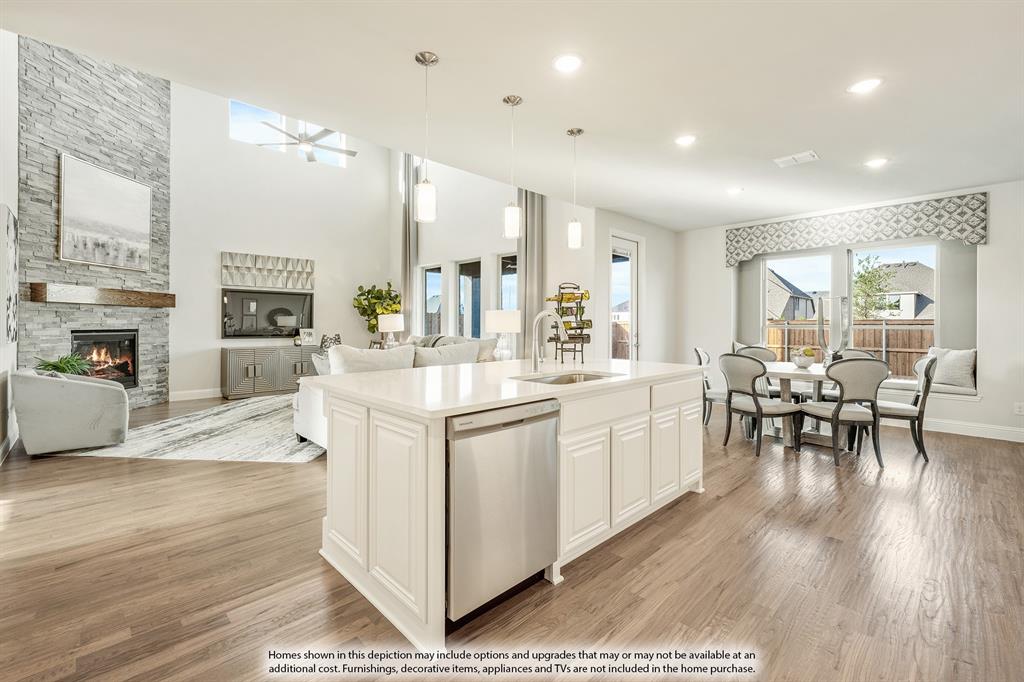 5230 Rutherford Drive Midlothian, TX 76065 - Photo 8 of 35 a large white dining hall with stainless steel appliances granite countertop a stove oven a flat screen tv and a fireplace